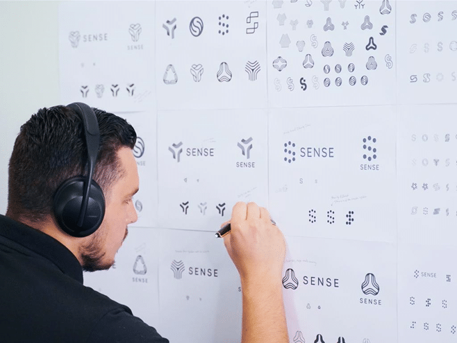 Startup team discussing professional logo design and brand identity.