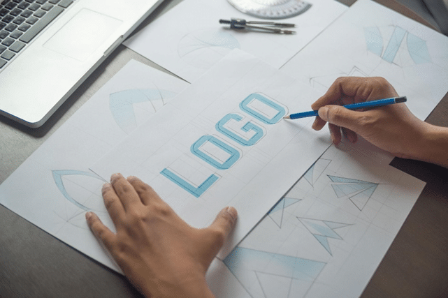 Logo design for startups comparing AI logo design and professional design agency.