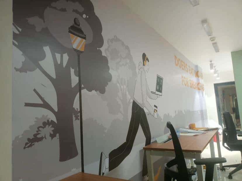 Custom illustrated office wall mural with branded graphics